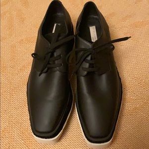 Stella McCartney Oxford platforms. Black leather.